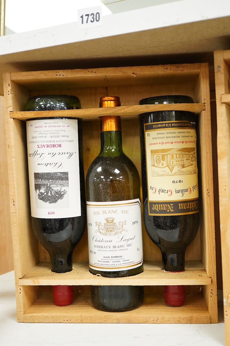 Five bottles of wine to include: two bottles of Bordeaux Chateau Marcelin Lafitte, 1979, two bottles of Chateau Naude Saint Emilion Grand Cu 1979 and a Chateau Lagut Bordeaux Blanc Sec 1979.